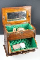 Late 19th / early 20th century oak vanity box / cabinet, the lid and fall front lower compartment