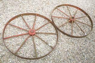 Pair of Jarmain Haseley spoked iron red painted iron cart wheels, approx 111cm diameter