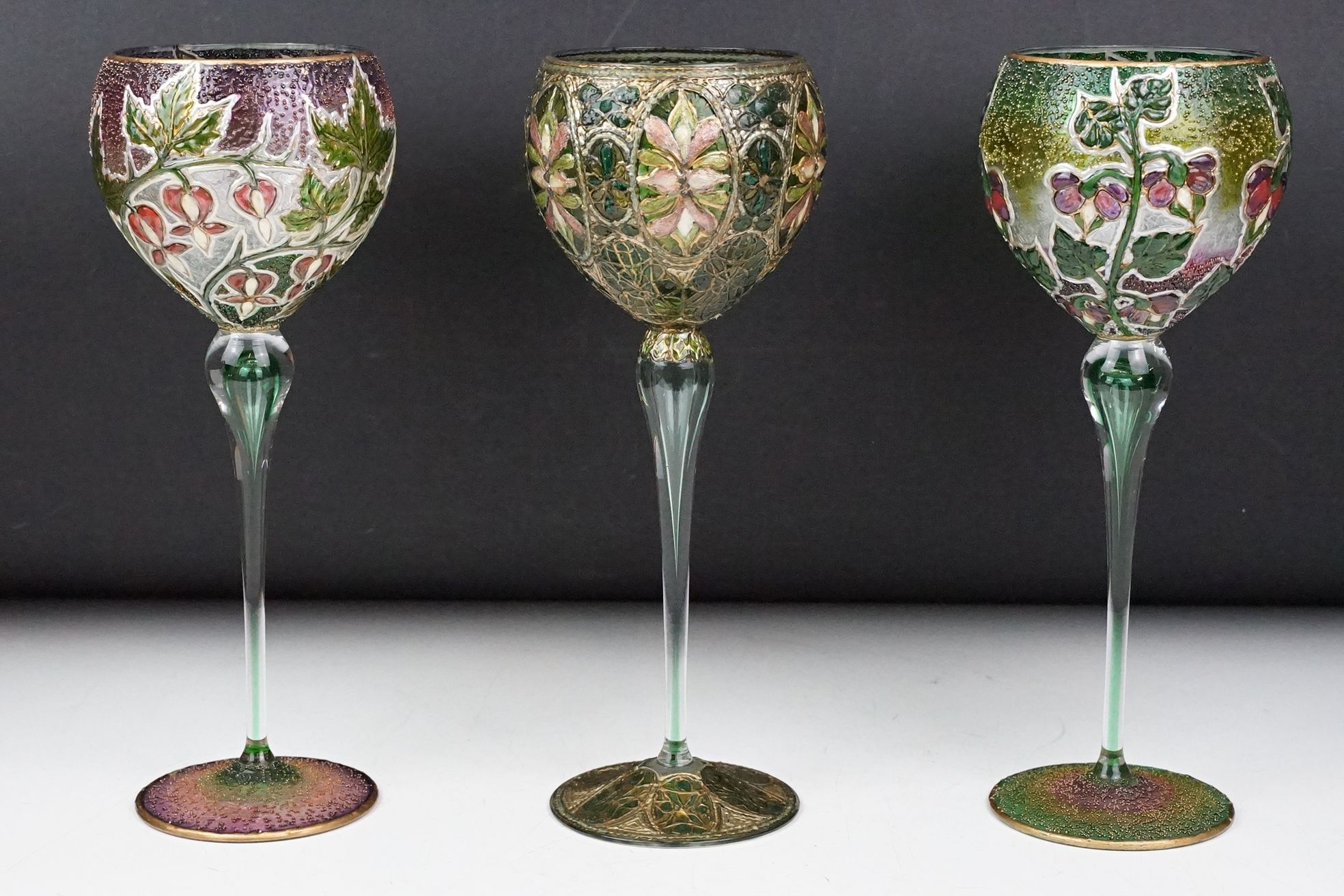 Set of three Violeta Markovic Art Nouveau style tall wine glasses, with tube lined and enamelled