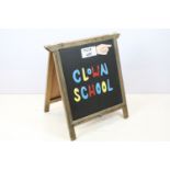 Circus style clown painted sandwich board, ' This Way Clown School ' and ' This Way ' verso, 76 x