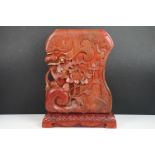 Chinese red lacquered carved wooden sculpture depicting a grotesque mask, bird & flower, approx 43cm