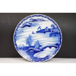 Chinese blue & white charger decorated with a scene with boat and mountains beyond, approx 40cm
