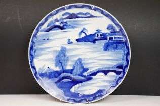 Chinese blue & white charger decorated with a scene with boat and mountains beyond, approx 40cm