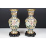 Pair of Chinese cloisonne vases of baluster form, with floral decoration on an olive green ground,