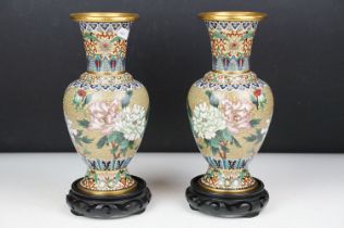 Pair of Chinese cloisonne vases of baluster form, with floral decoration on an olive green ground,