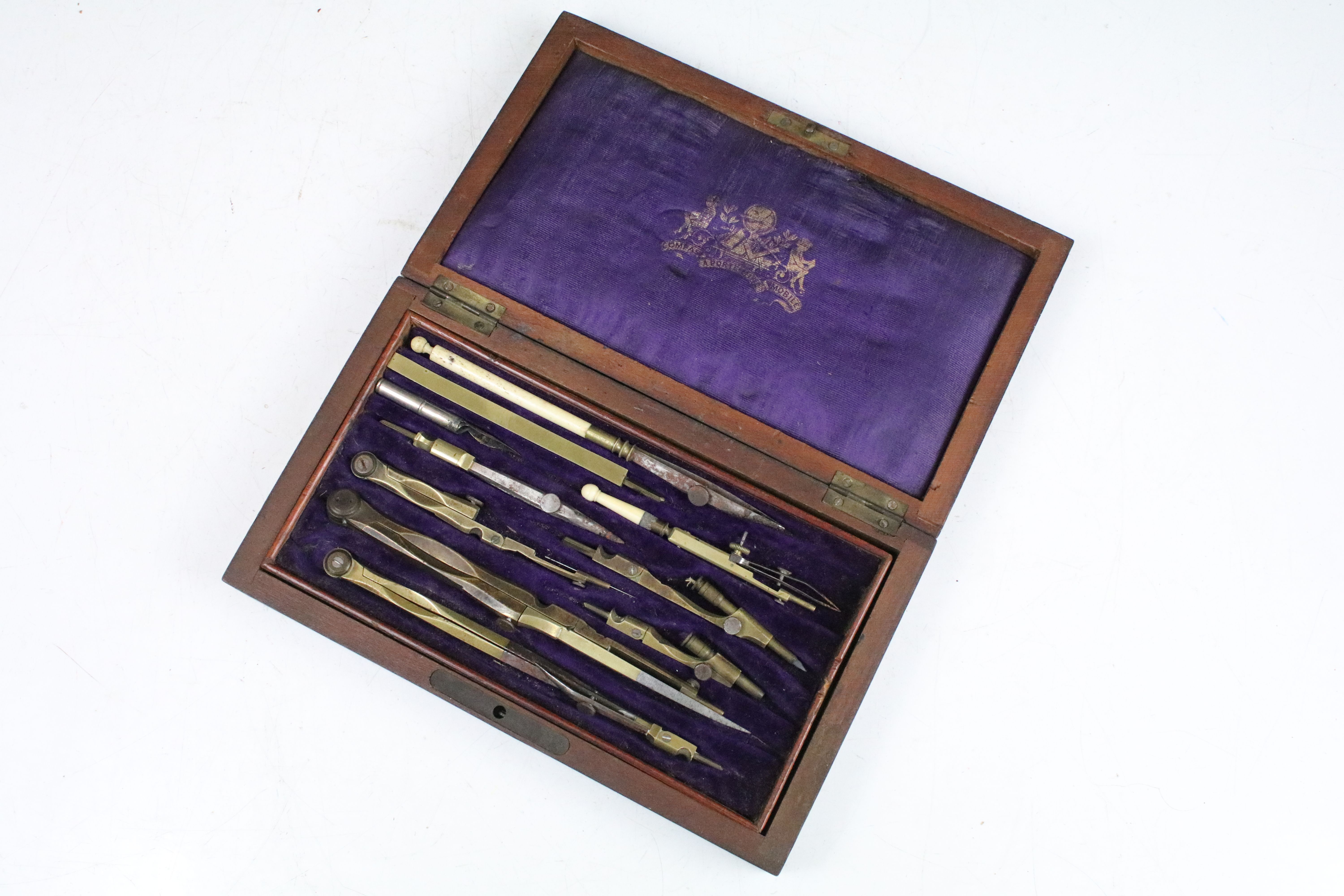 A vintage wooden cased drawing set to include compasses etc..