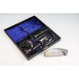 A cased Otoscope / ear inspection tool together with associated accessories.