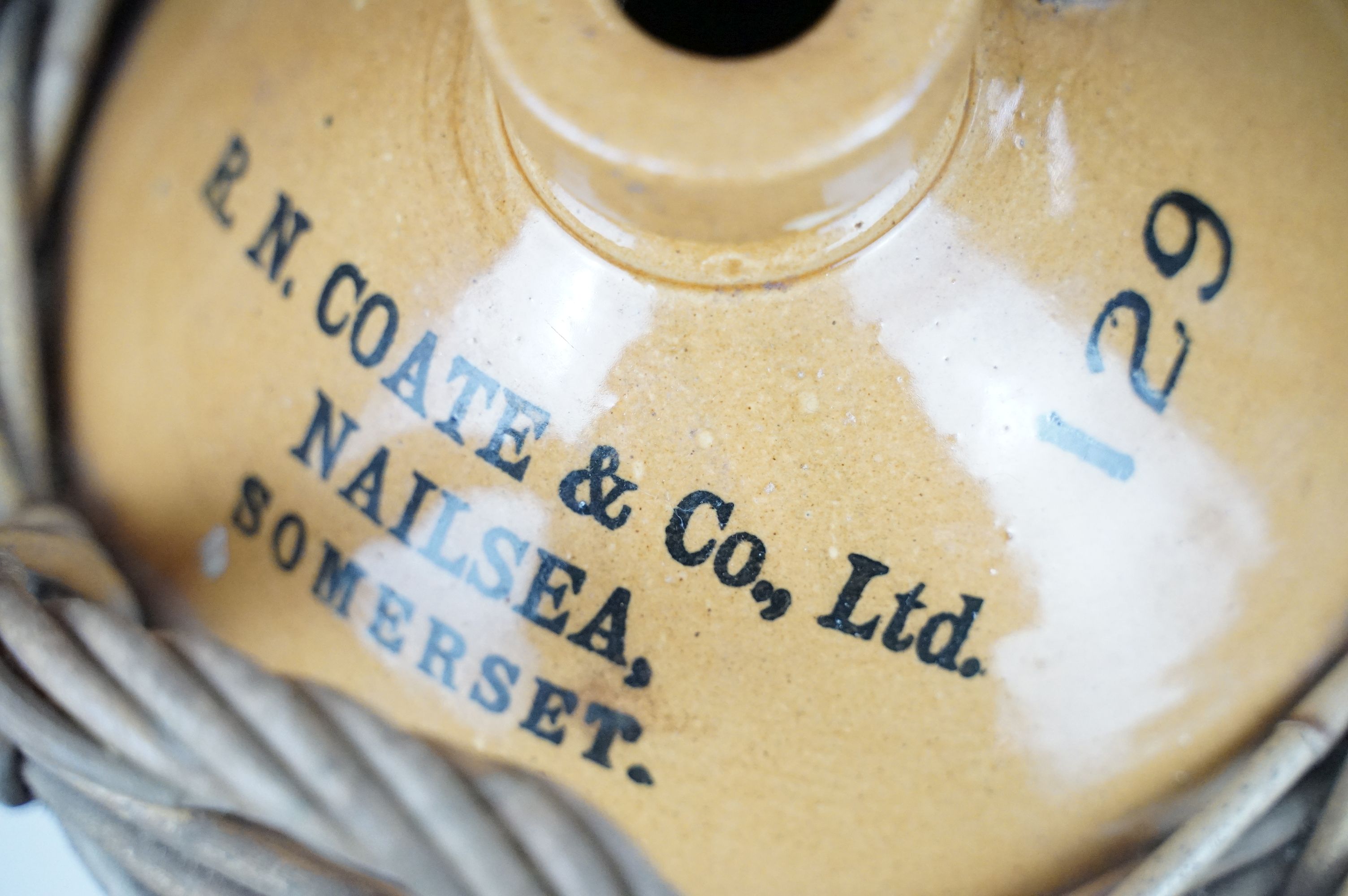 R.N. Coate & Co Ltd of Nailsea, Somerset - A stoneware cider flagon housed within a wicker - Image 4 of 10