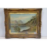 Swept gilt framed 19th century oil on canvas, Highland Loch View with figure and man in a boat,