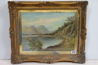 Swept gilt framed 19th century oil on canvas, Highland Loch View with figure and man in a boat,