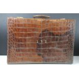 Vintage Luggage - A crocodile leather suitcase with gilt initials (approx 55cm wide), together