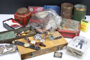 A box of mixed collectables to include coins, military badges, walllets and purses, marbles,