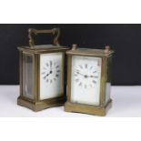 Two vintage brass cased carriage clocks with beveled glass panels and white enamel dials.