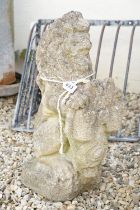 Reconstituted stone garden sculpture in the form of a rampant lion holding a shield, approx 63cm