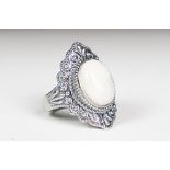 A ladies silver moonstone cabochon dress ring, marked 925 to the inner shank.
