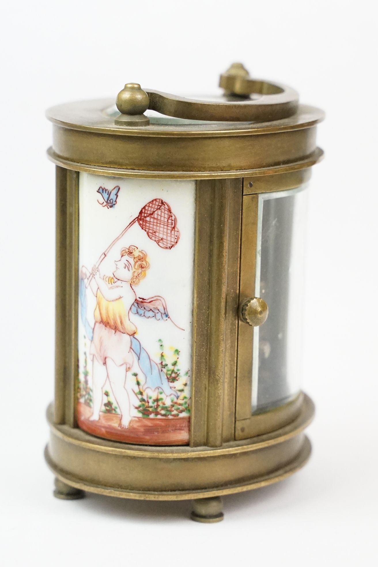 An antique French miniature carriage clock, brass cased with beveled glass panels, decorative Cherub - Image 7 of 10