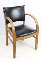 Mid century chair with curved open arms, the back with studded black leatherette panel and black