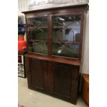 Early 20th century mahogany breakfront bookcase, the upper section with dentil moulding above