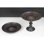 Chinese bronze tazza / footed dish with coin decoration to centre, together with a matching circular