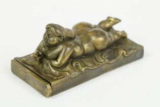 Brass cased vesta with figural nude figure