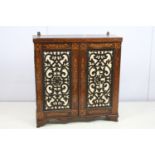 Victorian rosewood two door cupboard of small proportions, with inlaid decoration featuring leaves