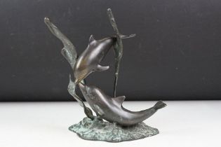 Patinated bronze sculpture of two dolphins amongst sea grasses, 20cm high