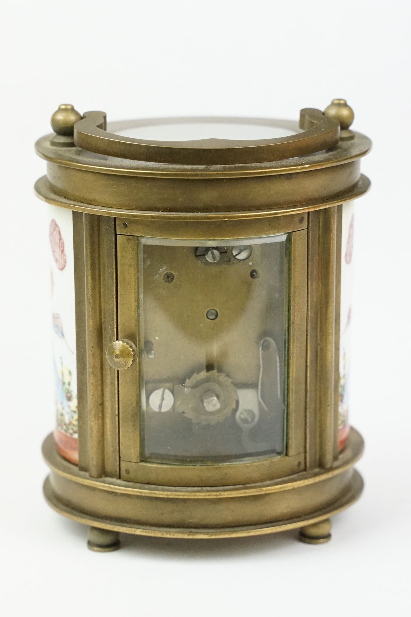 An antique French miniature carriage clock, brass cased with beveled glass panels, decorative Cherub - Image 6 of 10