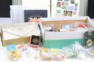 A small box of mixed collectables to include a stamp album with contents, royal mint coin sets,