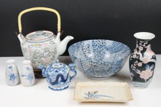 Collection of mixed Chinese ceramics including blue and white bowl on wooden stand, black ground