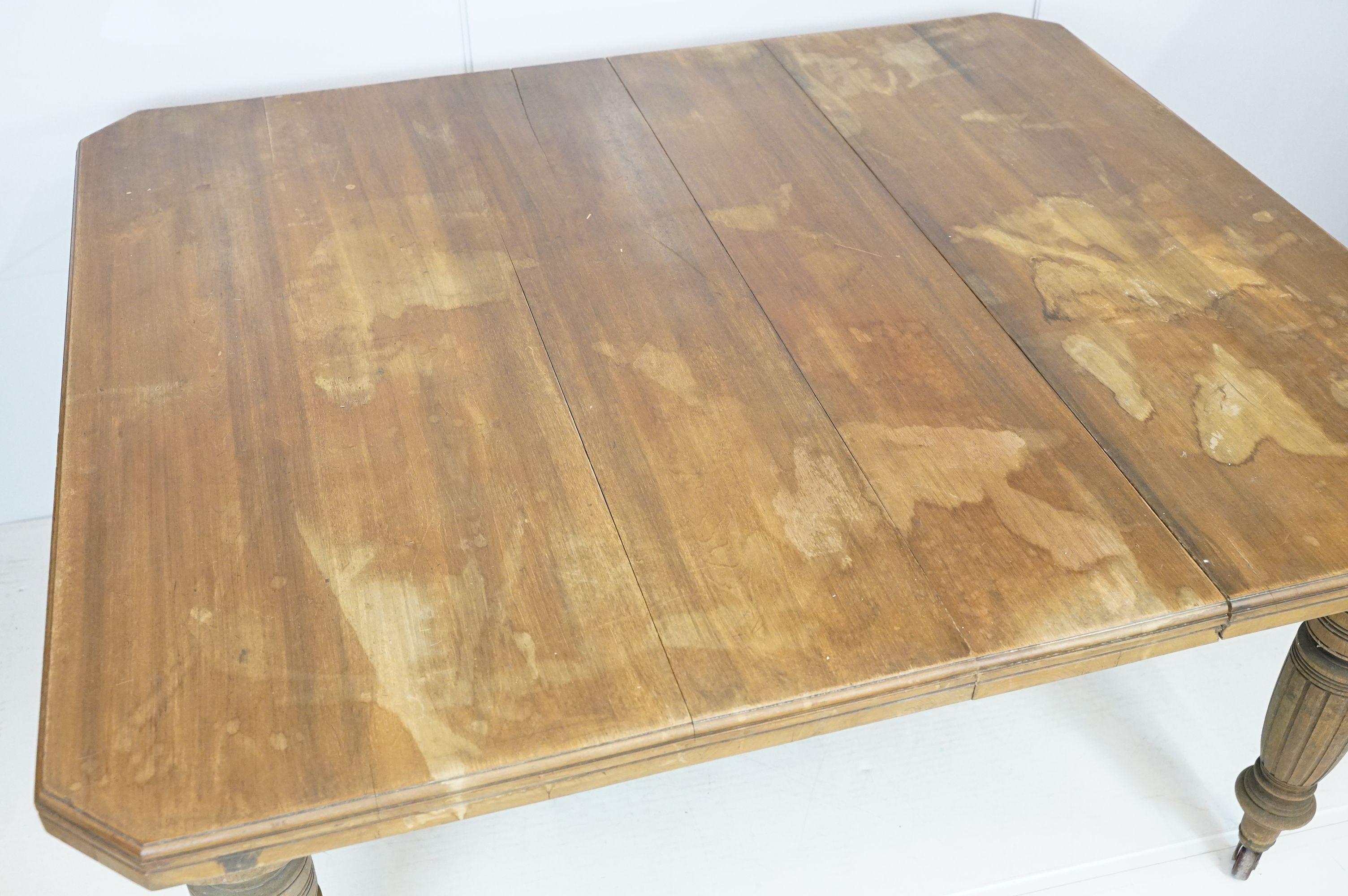 Early 20th century mahogany draw leaf dining table of rectangular form with canted corners on turned - Image 2 of 8