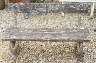 Garden bench with wooden seat & back rest, raised upon two cast iron supports in the form of