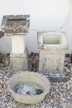 Reconstituted stone bird bath of square form, raised on a column support, measures approx 71cm high,