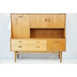 G Plan teak sideboard, with cupboards above two long drawers and a further cupboard, with maker's