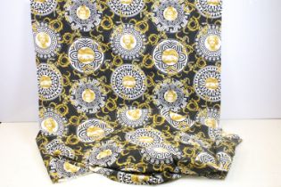 Large piece of black ground Versace style fabric, with repeating spiralling gold acanthus leaves