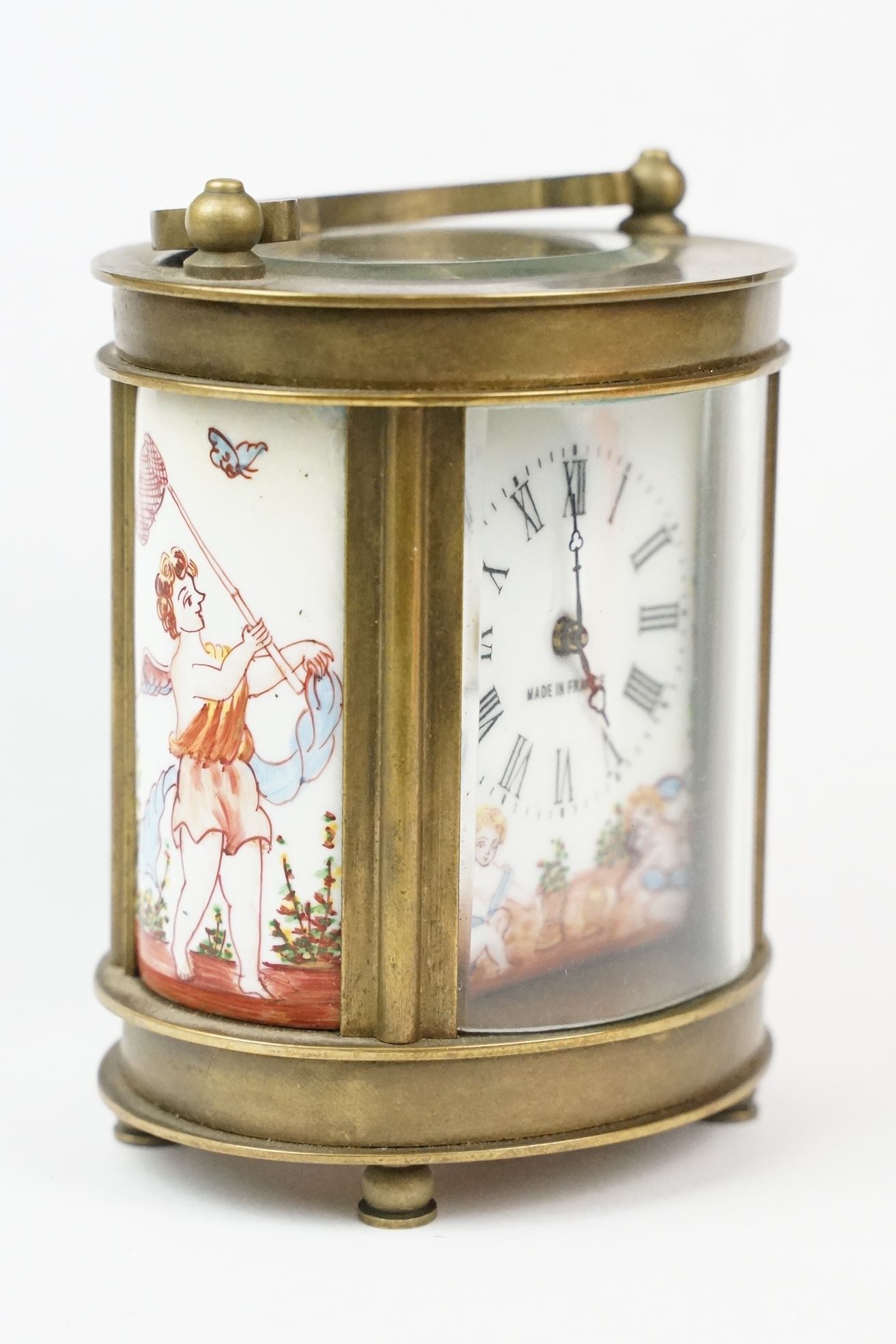 An antique French miniature carriage clock, brass cased with beveled glass panels, decorative Cherub - Image 4 of 10