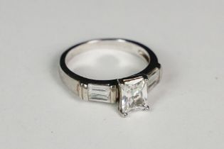 Silver and emerald cut CZ dress ring