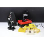 Childs microscope together with a light and a collection of glass microscope sample slides (the