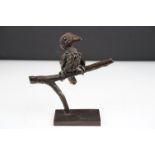 Graham High - A bronze sculpture of a bird perched on a branch, raised on a rectangular base, signed