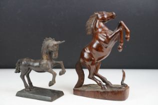 Bronze figure of a leaping unicorn, together with a carved hardwood model of a rearing horse (approx