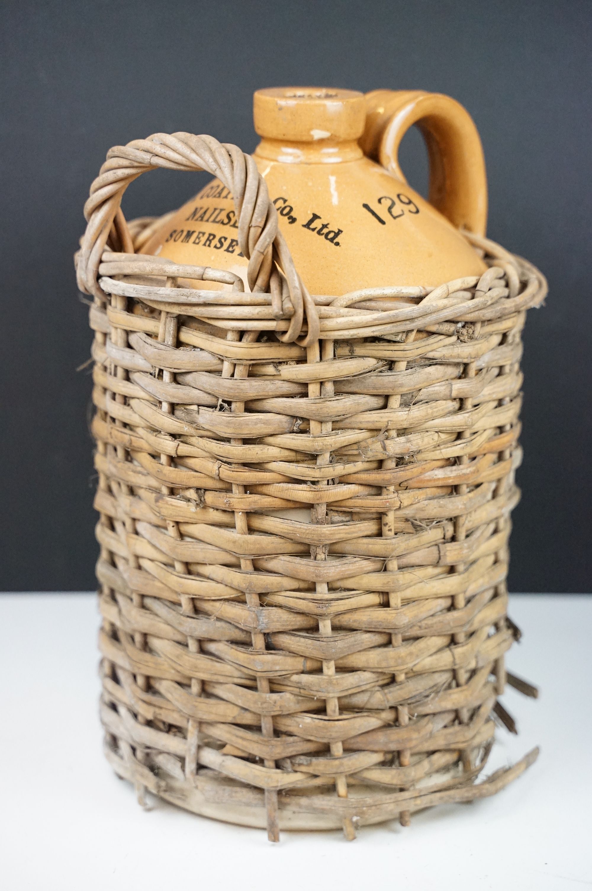 R.N. Coate & Co Ltd of Nailsea, Somerset - A stoneware cider flagon housed within a wicker - Image 2 of 10