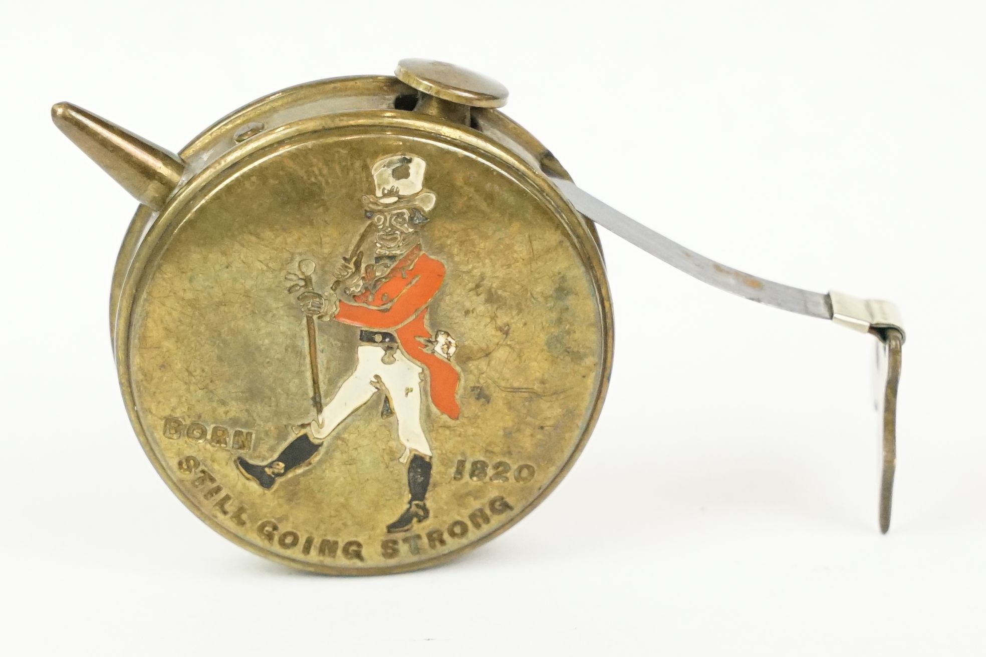 Early 20th century ' Johnnie Walker ' Whiskey Enamelled Bowls Tape Measure marked ' born 1820, still