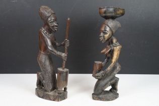 Pair of African carved hardwood stylised figures, tallest approx 34cm