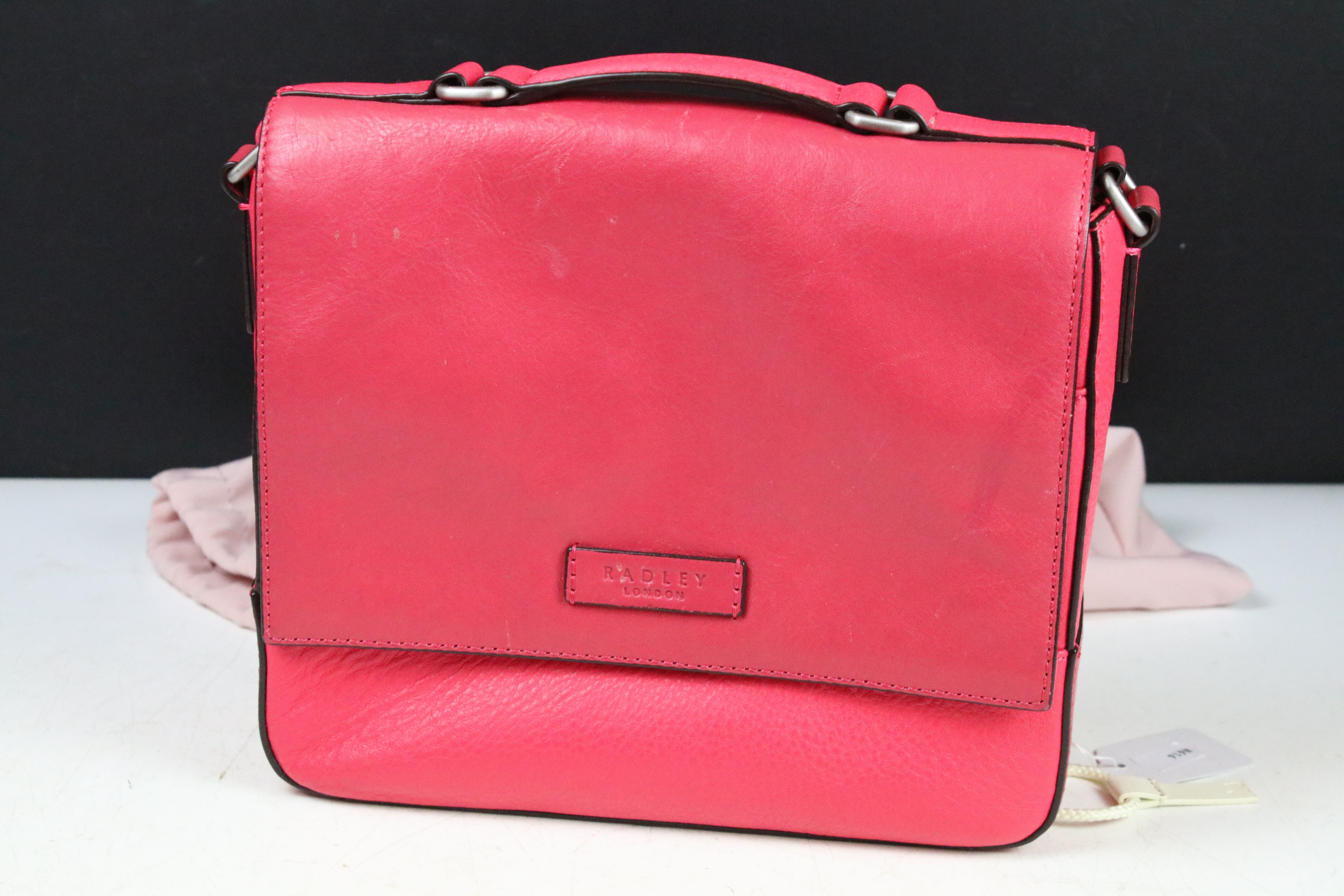Two Radley handbags to include a black leather handbag and a pink example, both housed within pink - Image 7 of 9