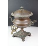 19th Century copper samovar, twin handled, with brass tap, raised on a base with four bun feet,