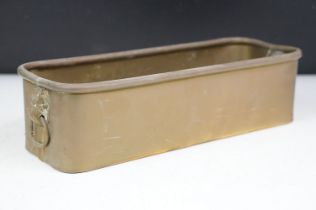 Brass planter of rectangular form with twin lion mask loop handles and rolled upper rim, approx 29cm
