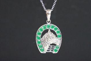 Silver and emerald horse shoe pendant necklace