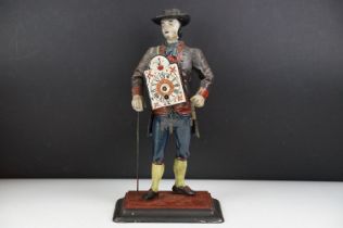 Dutch painted cast metal novelty clock in the form of a clock peddler, approx 38cm high