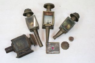 Group of four antique carriage lanterns to include three brass examples