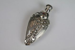 Perfume bottle in the art deco style set with ruby bird eyes