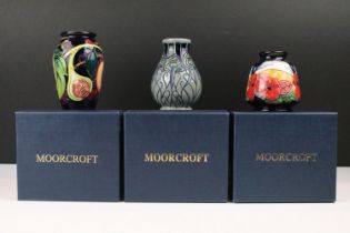 Three Moorcroft vases to include a Forever England vase, Peacock Parade vase and a Queens Choice